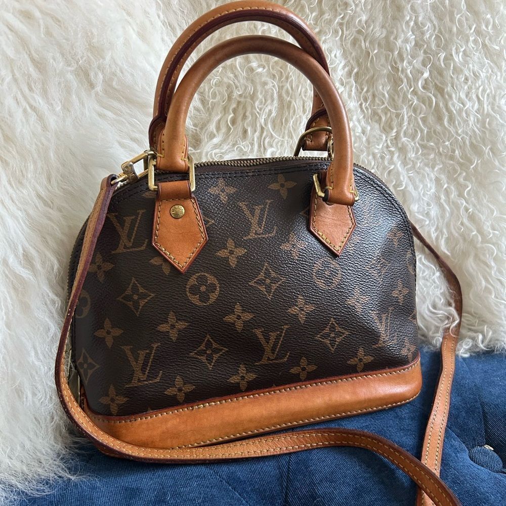 Louis Vuitton Alma bb leather handbag